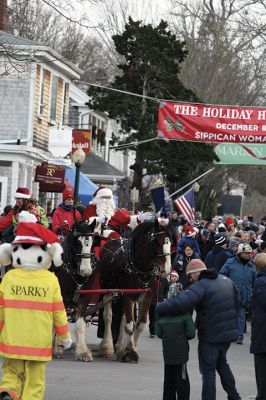 Marion Holiday Stroll
The Marion village streets were filled with holiday revelers on Sunday, December 9, for the annual Marion Holiday Stroll. Santa’s boat docked at the Marion Wharf where the faces of hundreds of children lit up at his arrival. Santa boarded a horse-drawn carriage and paraded through the streets, passing businesses offering free goodies and dodging the whereabouts of that old Grinch who didn’t seem to mind Christmas coming at all this year. Photos by Jean Perry
