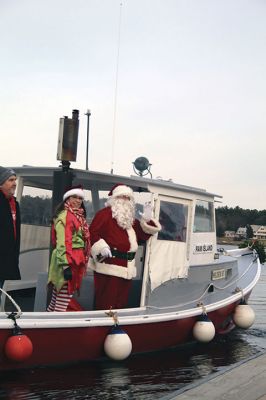 Marion Holiday Stroll
The Marion village streets were filled with holiday revelers on Sunday, December 9, for the annual Marion Holiday Stroll. Santa’s boat docked at the Marion Wharf where the faces of hundreds of children lit up at his arrival. Santa boarded a horse-drawn carriage and paraded through the streets, passing businesses offering free goodies and dodging the whereabouts of that old Grinch who didn’t seem to mind Christmas coming at all this year. Photos by Jean Perry
