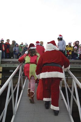 Marion Holiday Stroll
The Marion village streets were filled with holiday revelers on Sunday, December 9, for the annual Marion Holiday Stroll. Santa’s boat docked at the Marion Wharf where the faces of hundreds of children lit up at his arrival. Santa boarded a horse-drawn carriage and paraded through the streets, passing businesses offering free goodies and dodging the whereabouts of that old Grinch who didn’t seem to mind Christmas coming at all this year. Photos by Jean Perry

