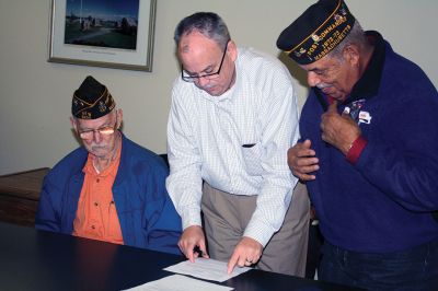 Benjamin D. Cushing VFW Post 2425
Members of the Benjamin D. Cushing VFW Post 2425 were present on Wednesday, December 7, for the signing over of the 465 Mill Street VFW building, marking the official transfer of the building to the Town. Selectmen thanked the gentlemen for their years of service within the town before Post Commander Demi Barros and Rodney Hunt signed the deed. Photo by Jean Perry
