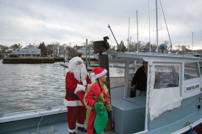 Marion Village Stroll 
The Marion Village Stroll on Sunday includes a visit from Santa who arrived by boat and then was transported by wagon to meet the children. Photo by Felix Perez
