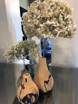 Mattapoisett Library 
From now until the end of June, enjoy the artistic paring of library books and sculpture at the Mattapoisett Library exhibit of works by Nathaniel Fuchs. An epidemiologist by day, Fuchs enjoys creating works from wood. Some have been created from an apple tree that once was a source of play for the Fuchs brothers. Now a trio of vases remain as beautiful reminders of those carefree days. Photos by Marilou Newell
