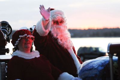 Mattapoisett Tree Lighting
Mattapoisett lit one of the biggest trees Shipyard Park has ever seen at the 2011 Holiday in the Park. There was food from local establishments, ornament making, merry music and Santa! The moment was enough to spur two romantic marriage proposals. Organizers reported that over a thousand people attended the tree lighting, making it the biggest Holiday in the Park ever. Photo by Anne Kakley.
