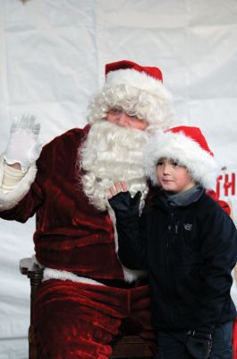 Mattapoisett Tree Lighting
Mattapoisett lit one of the biggest trees Shipyard Park has ever seen at the 2011 Holiday in the Park. There was food from local establishments, ornament making, merry music and Santa! The moment was enough to spur two romantic marriage proposals. Organizers reported that over a thousand people attended the tree lighting, making it the biggest Holiday in the Park ever. Photo by Anne Kakley.
