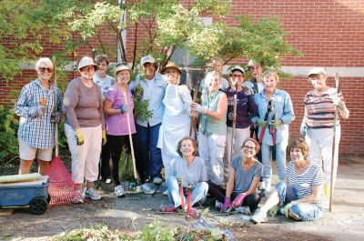 Mattapoisett Woman's Club 
On September 28, the garden group of the Mattapoisett Woman's Club brought shovels, clippers, trowels, and rakes to the badly overgrown butterfly garden at Center School and cleared out the overgrowth and weeds. The garden will be dedicated to Suzanne Sylvester who along with two other teachers designed, planted, and used this garden to teach students about butterflies. Suzanne was a member of the Mattapoisett Woman's Club and garden group, and this endeavor is in memory of her. Photo courtesy Karen Gardner

