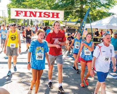 Mattapoisett Road Race 
The 50th running of the Mattapoisett 5 Mile Road Race took place on July 4. Margot Appleton and Trevor Wysong were the respective female and male winners. Photos by Ryan Feeney
