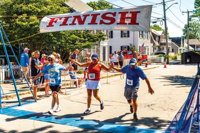 Mattapoisett Road Race 
The 50th running of the Mattapoisett 5 Mile Road Race took place on July 4. Margot Appleton and Trevor Wysong were the respective female and male winners. Photos by Ryan Feeney
