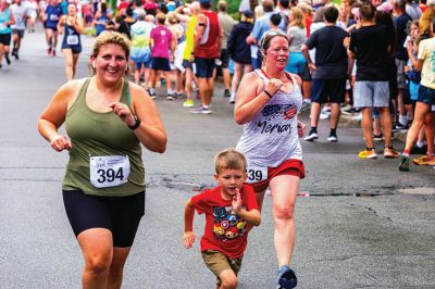 Mattapoisett Road Race
A humid atmosphere challenged the competitors, but the Mattapoisett Road Race was nonetheless conquered by over 1,000 runners. Photos by Ryan Feeney
