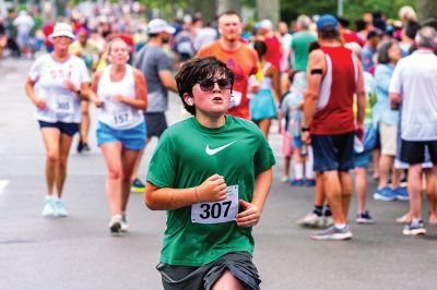 Mattapoisett Road Race
A humid atmosphere challenged the competitors, but the Mattapoisett Road Race was nonetheless conquered by over 1,000 runners. Photos by Ryan Feeney
