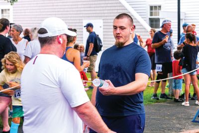 Mattapoisett Road Race
A humid atmosphere challenged the competitors, but the Mattapoisett Road Race was nonetheless conquered by over 1,000 runners. Photos by Ryan Feeney
