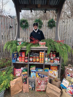 Cy Huggins
Cy Huggins of Mattapoisett, a freshman at Bristol County Agricultural High School, collected food for the United Way food pantry as part of his school's community service project. Photo by Laura McLean
