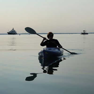 Morning Kayaking
As with many mornings, not a ripple was seen or felt across Mattapoisett Harbor except those made by kayaker Cecile Callahan as August got underway. More recent tidal interference brought on by tropical storm Henri and the full moon have since receded, leaving us with our own peaceful if dreamy water world again. Photo by Laura McLean. August 26, 2021 edition
