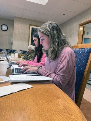 Memoir-writing
Old Rochester Regional High School National Honor Society members Aleena McCarthy and Keelin Lienkanp were among participants in a memoir-writing project with residents of the Sippican Healthcare Center in Marion. Each student was paired with a resident who shared life stories, out of which the students produced a memoir and gifted it to the resident on November 1. Photo by Marilou Newell
