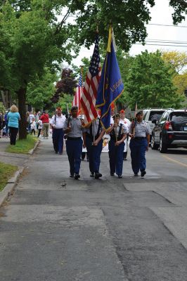 Memorial Day 2014
Scores of Mattapoisett residents gathered in front of the Mattapoisett Free Library the drizzly afternoon of May 26 to pay homage to veteran Americans who lost their lives. Onlookers filled the lawn and spilled out into the street to watch the Memorial Day ceremony with special guest speaker Navy Reserve Commander Paul J. Brawley who served more than 22 years of active duty and reserve service. After the ceremony, participants paraded through the town to the town wharf. Photo By Jean Perry
