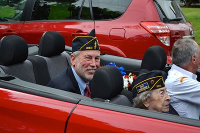 Memorial Day 2014
Scores of Mattapoisett residents gathered in front of the Mattapoisett Free Library the drizzly afternoon of May 26 to pay homage to veteran Americans who lost their lives. Onlookers filled the lawn and spilled out into the street to watch the Memorial Day ceremony with special guest speaker Navy Reserve Commander Paul J. Brawley who served more than 22 years of active duty and reserve service. After the ceremony, participants paraded through the town to the town wharf. Photo By Jean Perry
