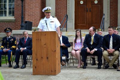 Memorial Day 2014
Scores of Mattapoisett residents gathered in front of the Mattapoisett Free Library the drizzly afternoon of May 26 to pay homage to veteran Americans who lost their lives. Onlookers filled the lawn and spilled out into the street to watch the Memorial Day ceremony with special guest speaker Navy Reserve Commander Paul J. Brawley who served more than 22 years of active duty and reserve service. After the ceremony, participants paraded through the town to the town wharf. Photo By Jean Perry
