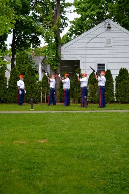 Memorial Day 2014
Scores of Mattapoisett residents gathered in front of the Mattapoisett Free Library the drizzly afternoon of May 26 to pay homage to veteran Americans who lost their lives. Onlookers filled the lawn and spilled out into the street to watch the Memorial Day ceremony with special guest speaker Navy Reserve Commander Paul J. Brawley who served more than 22 years of active duty and reserve service. After the ceremony, participants paraded through the town to the town wharf. Photo By Jean Perry
