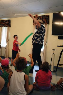 Minecraft Magician 
It was all about “Building a Better World” on August 14 during a children’s performance sponsored by the Plumb Library and the Rochester Cultural Council. Performer “Jungle Jim” Manning merged Minecraft with magic and built a blast of a time with the kids. Photos by Jean Perry
