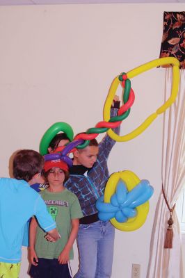 Minecraft Magician 
It was all about “Building a Better World” on August 14 during a children’s performance sponsored by the Plumb Library and the Rochester Cultural Council. Performer “Jungle Jim” Manning merged Minecraft with magic and built a blast of a time with the kids. Photos by Jean Perry
