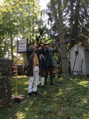 Rochester Historical Society
Militiamen Malcolm Phinney, Gary Franklin, and Jay Franklin performed an honor salute on October 2 at Woodside Cemetery as part of the Rochester Historical Society’s fall event debuting their Treasures of the Museum exhibit. Sixteen graves of soldiers have been found in the cemetery thus far from the Revolution, Civil War, and the War of 1812. Photos by Marilou Newell

