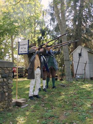 Rochester Historical Society
Militiamen Malcolm Phinney, Gary Franklin, and Jay Franklin performed an honor salute on October 2 at Woodside Cemetery as part of the Rochester Historical Society’s fall event debuting their Treasures of the Museum exhibit. Sixteen graves of soldiers have been found in the cemetery thus far from the Revolution, Civil War, and the War of 1812. Photos by Marilou Newell
