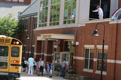 Mr. T!
Students chanted “Mr. T!” to Mr. Tavares on the roof as they left school June 18. Kevin Tavares, associate principal, challenged the kids to raise 481 canned goods to top Mr. T’s 480 – they collected over 800 instead! Mr. T had to spend the night on the roof of Center School, calling the community out to visit him and bring canned goods so he could match the students’ grand total. Photos by Jean Perry
