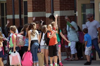 Mr. T!
Students chanted “Mr. T!” to Mr. Tavares on the roof as they left school June 18. Kevin Tavares, associate principal, challenged the kids to raise 481 canned goods to top Mr. T’s 480 – they collected over 800 instead! Mr. T had to spend the night on the roof of Center School, calling the community out to visit him and bring canned goods so he could match the students’ grand total. Photos by Jean Perry
