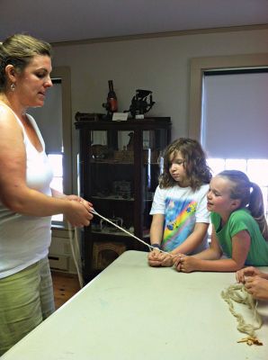 Mattapoisett Historical Society
Mattapoisett Historical Society museum curator Elizabeth Hutchison explaining how rope is made at the museum's "History by Hand" event last week. Photo by Renae Reints.
