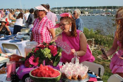 Community Picnic
The Mattapoisett Land Trust held its annual community picnic on August 3 at the Munro Preserve, complete with oyster service. Taking first place for best centerpiece was Table 29 with its Barbie theme. The Whale, at Table 1, was runner-up, and the Bird table (27) was third. Seth Asser and Gary Brown provided live music for the BYOB event. Photos by Mick Colageo
