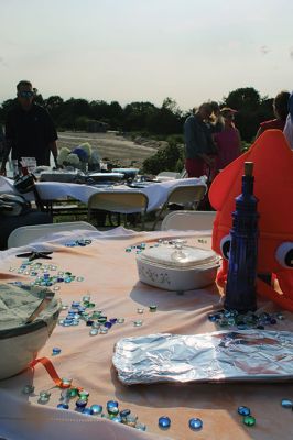 Community Picnic
The Mattapoisett Land Trust held its annual community picnic on August 3 at the Munro Preserve, complete with oyster service. Taking first place for best centerpiece was Table 29 with its Barbie theme. The Whale, at Table 1, was runner-up, and the Bird table (27) was third. Seth Asser and Gary Brown provided live music for the BYOB event. Photos by Mick Colageo
