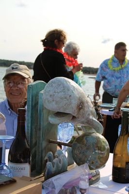 Community Picnic
The Mattapoisett Land Trust held its annual community picnic on August 3 at the Munro Preserve, complete with oyster service. Taking first place for best centerpiece was Table 29 with its Barbie theme. The Whale, at Table 1, was runner-up, and the Bird table (27) was third. Seth Asser and Gary Brown provided live music for the BYOB event. Photos by Mick Colageo
