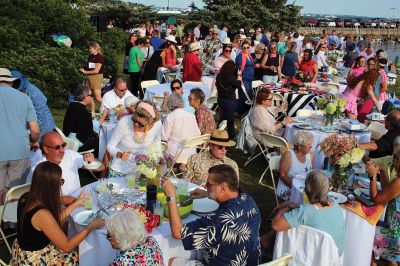 Community Picnic
The Mattapoisett Land Trust held its annual community picnic on August 3 at the Munro Preserve, complete with oyster service. Taking first place for best centerpiece was Table 29 with its Barbie theme. The Whale, at Table 1, was runner-up, and the Bird table (27) was third. Seth Asser and Gary Brown provided live music for the BYOB event. Photos by Mick Colageo
