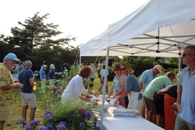 Community Picnic
The Mattapoisett Land Trust held its annual community picnic on August 3 at the Munro Preserve, complete with oyster service. Taking first place for best centerpiece was Table 29 with its Barbie theme. The Whale, at Table 1, was runner-up, and the Bird table (27) was third. Seth Asser and Gary Brown provided live music for the BYOB event. Photos by Mick Colageo
