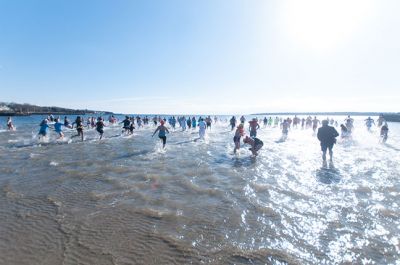 Freezin' for a Reason 2014
Participants in the 2014 Polar Plunge on January 1 were encouraged to wear costumes for the event, which raised thousands of dollars for the BAM Foundation. BAM is an organization that offers financial assistance to families battling cancer to help offset the unexpected costs of cancer treatment. Hundreds of people turned out for the event, with over a hundred participants who plunged into 34 degree waters, just a few degrees warmer than the 28 degree air temperature that morning.  Photo by Felix Perez
