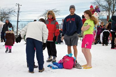 New Year Plunge
On January 1, 2013, Mattapoisett Town Beach played host to a New Year’s polar plunge fundraiser.  The event, which attracted over 400 people, raised money to benefit BAM Foundation, Inc., a New Bedford non-profit which donates money to South Coast families dealing with members who have cancer.  The Huggins family of Mattapoisett received such a donation while husband and father, William, was in treatment for cancer in his colon and liver.  Photo by Eric Tripoli
