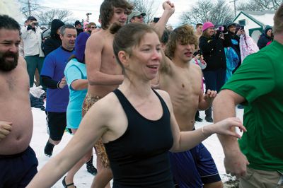 New Year Plunge
On January 1, 2013, Mattapoisett Town Beach played host to a New Year’s polar plunge fundraiser.  The event, which attracted over 400 people, raised money to benefit BAM Foundation, Inc., a New Bedford non-profit which donates money to South Coast families dealing with members who have cancer.  The Huggins family of Mattapoisett received such a donation while husband and father, William, was in treatment for cancer in his colon and liver.  Photo by Eric Tripoli
