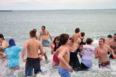 New Year Plunge
On January 1, 2013, Mattapoisett Town Beach played host to a New Year’s polar plunge fundraiser.  The event, which attracted over 400 people, raised money to benefit BAM Foundation, Inc., a New Bedford non-profit which donates money to South Coast families dealing with members who have cancer.  The Huggins family of Mattapoisett received such a donation while husband and father, William, was in treatment for cancer in his colon and liver.  Photo by Eric Tripoli
