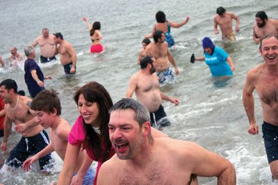 New Year Plunge
On January 1, 2013, Mattapoisett Town Beach played host to a New Year’s polar plunge fundraiser.  The event, which attracted over 400 people, raised money to benefit BAM Foundation, Inc., a New Bedford non-profit which donates money to South Coast families dealing with members who have cancer.  The Huggins family of Mattapoisett received such a donation while husband and father, William, was in treatment for cancer in his colon and liver.  Photo by Eric Tripoli
