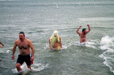 New Year Plunge
On January 1, 2013, Mattapoisett Town Beach played host to a New Year’s polar plunge fundraiser.  The event, which attracted over 400 people, raised money to benefit BAM Foundation, Inc., a New Bedford non-profit which donates money to South Coast families dealing with members who have cancer.  The Huggins family of Mattapoisett received such a donation while husband and father, William, was in treatment for cancer in his colon and liver.  Photo by Eric Tripoli
