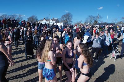 Freezin’ for a Reason Polar Plunge
It takes a certain type of person to jump into the cold ocean on New Year’s morning. Behold, the locals who fit that description as they enjoy a frosty January 1st at Mattapoisett Town Beach for the annual Freezin’ for a Reason Polar Plunge! Hundreds lined the beach to take the plunge, with bundled spectators watching from the sidelines and cheering as the plungers charged ahead screaming and shrieking with exhilaration. Proceeds from the plunge benefit locals battling cancer. Photos by Colin Veitch
