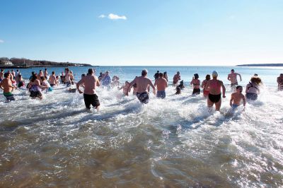 Freezin’ for a Reason Polar Plunge
It takes a certain type of person to jump into the cold ocean on New Year’s morning. Behold, the locals who fit that description as they enjoy a frosty January 1st at Mattapoisett Town Beach for the annual Freezin’ for a Reason Polar Plunge! Hundreds lined the beach to take the plunge, with bundled spectators watching from the sidelines and cheering as the plungers charged ahead screaming and shrieking with exhilaration. Proceeds from the plunge benefit locals battling cancer. Photos by Colin Veitch
