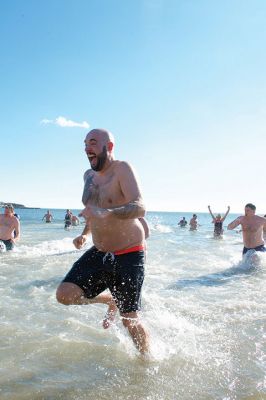 Freezin’ for a Reason Polar Plunge
It takes a certain type of person to jump into the cold ocean on New Year’s morning. Behold, the locals who fit that description as they enjoy a frosty January 1st at Mattapoisett Town Beach for the annual Freezin’ for a Reason Polar Plunge! Hundreds lined the beach to take the plunge, with bundled spectators watching from the sidelines and cheering as the plungers charged ahead screaming and shrieking with exhilaration. Proceeds from the plunge benefit locals battling cancer. Photos by Colin Veitch
