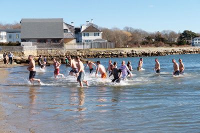 Freezin’ for a Reason Polar Plunge
It takes a certain type of person to jump into the cold ocean on New Year’s morning. Behold, the locals who fit that description as they enjoy a frosty January 1st at Mattapoisett Town Beach for the annual Freezin’ for a Reason Polar Plunge! Hundreds lined the beach to take the plunge, with bundled spectators watching from the sidelines and cheering as the plungers charged ahead screaming and shrieking with exhilaration. Proceeds from the plunge benefit locals battling cancer. Photos by Colin Veitch
