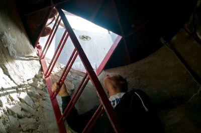 Lighthouse Tours
After a walk up a stone spiral staircase, the red ladder brings you up to the top of Ned's Point Lighthouse in Mattapoisett.  Photo by Eric Tripoli.
