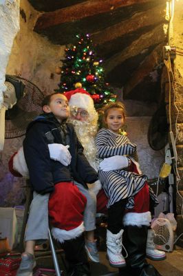 Ned’s Point Santa
Santa made a stop at the Ned’s Point Lighthouse just after dusk on Saturday, December 15, while the U.S. Coast Guard Auxiliary opened up the lighthouse doors for tours and decked the historic Mattapoisett icon with evergreens, bows, and lights. Photos by Jean Perry
