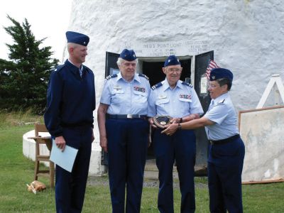 Ned's Point Honors
Commodore Renell LeBlanc  presents the prestigious Larry and Lenore Closson Family Award to Betty and Bert Theriault for thirty-four years of outstanding service to the U.S. Coast Guard Auxiliary. Photo by Bill Beane, IPFC Flotilla 63.
