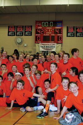 OHBBall 4245
In a close game, the Old Hammondtown School students outplayed the Old H teachers 41-40 during the annual students vs. teachers basketball game Friday night. The game was held at the ORR gymnasium and bleachers were packed with families and supporters. Photos by Jean Perry
