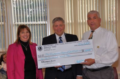 Harlem Ambassadors 
Don Bamberger President of the Mattapoisett Lions Club and Deb Martin President of the Rochester Lions Club presented Superintendent Doug White (center) with a check for $1,000 for the ORR School District. The recent Harlem Ambassadors game also raised $750 for local elementary schools. Photo courtesy of Rebecca McCullough.
