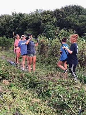 ORR Field Hockey
Each year, the Old Rochester Regional High School field hockey team members engage in a community service project. This year, on September 15, they went to "Sharing the Harvest Community Farm" at the YMCA of Dartmouth. The team worked hard in planting and preparing the fields for the next set of crops. All the produce is donated to 20 local hunger relief programs throughout the South Coast region. Photo courtesy Kate Souza
