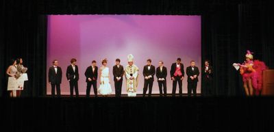 Mr. ORR
Participants of "Mr. ORR" wait in their formal wear for host Paul Sardinha to announce the winners as Callie Gomes and Leah Thomas stand to the left with the winners' prizes. Photo by Renae Reints.
